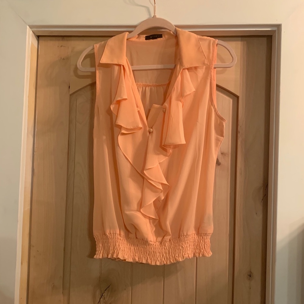 Darling sleeveless blouse.